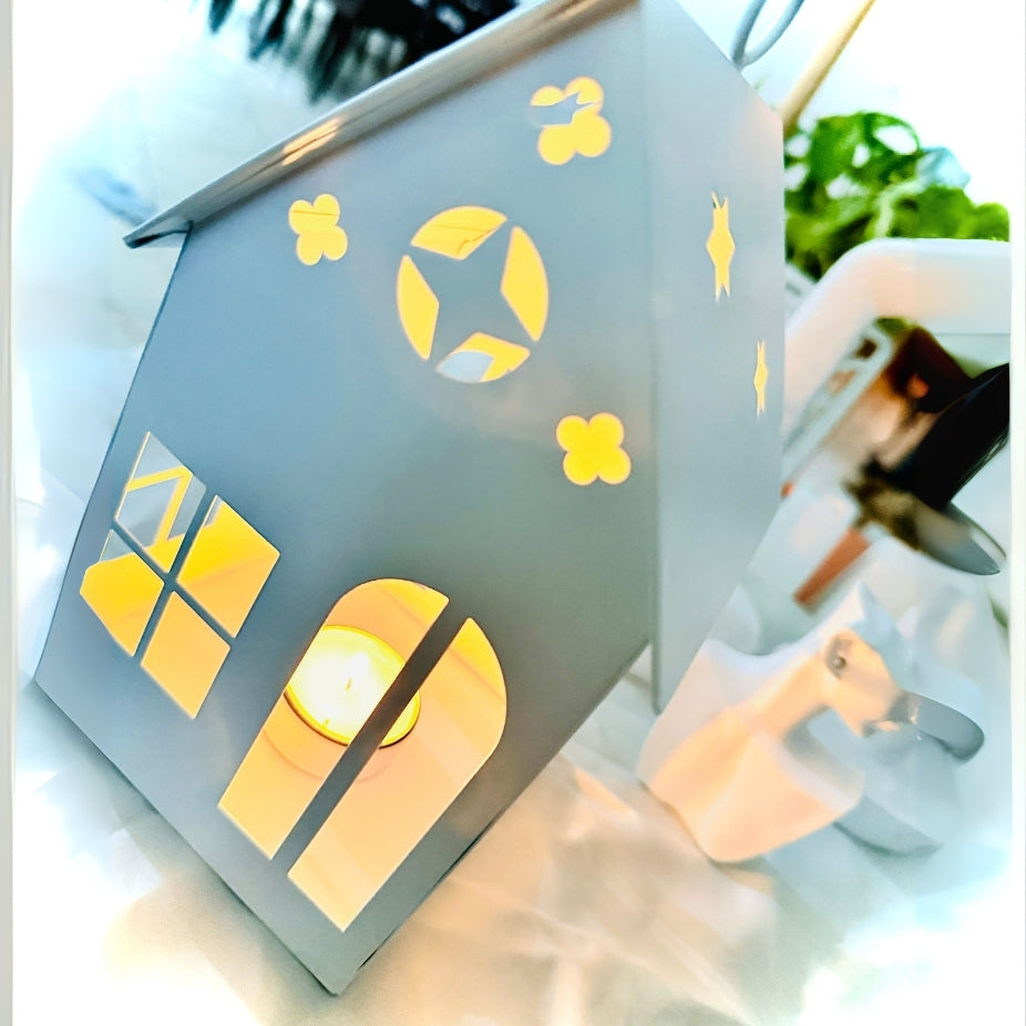 Decorative wall art with cut-out shapes on a white surface