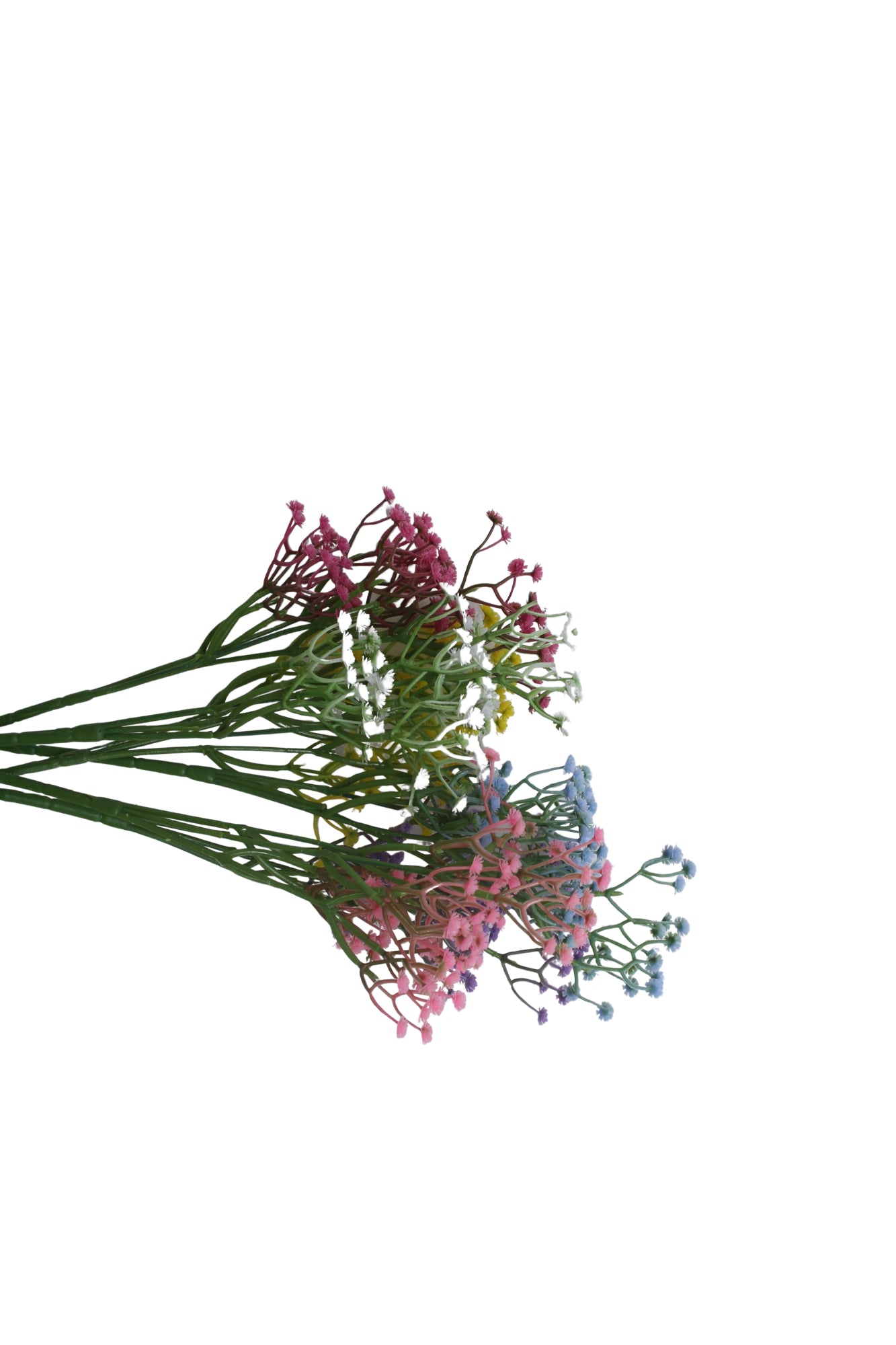 Multicolored artificial flowers on a white background