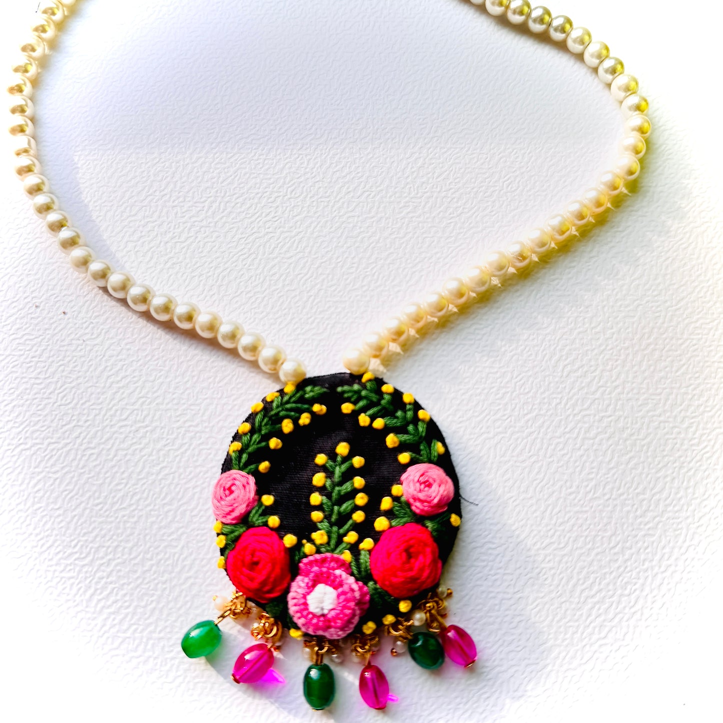 Necklace with a floral pendant on a white background