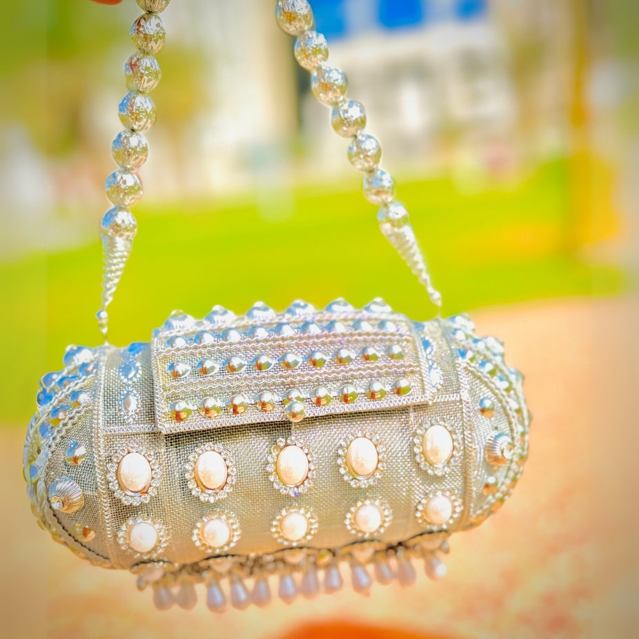 Unique handcrafted round Banjara metal handbag adding charm to traditional outfits