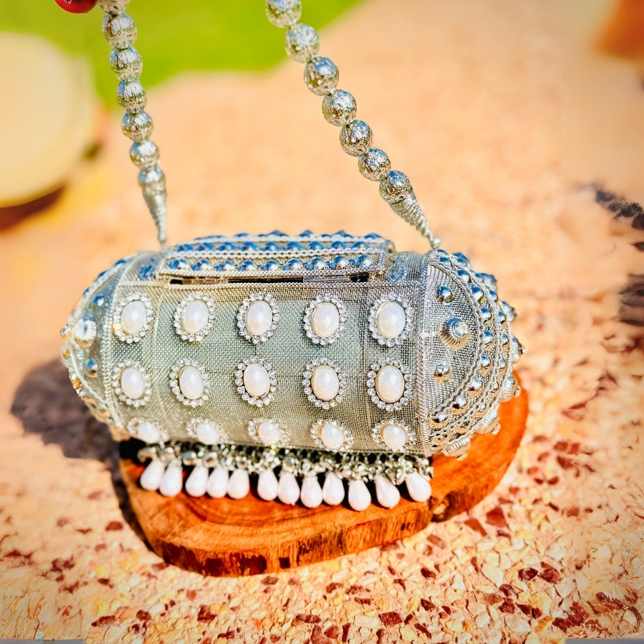 Unique handcrafted round Banjara metal handbag adding charm to traditional outfits