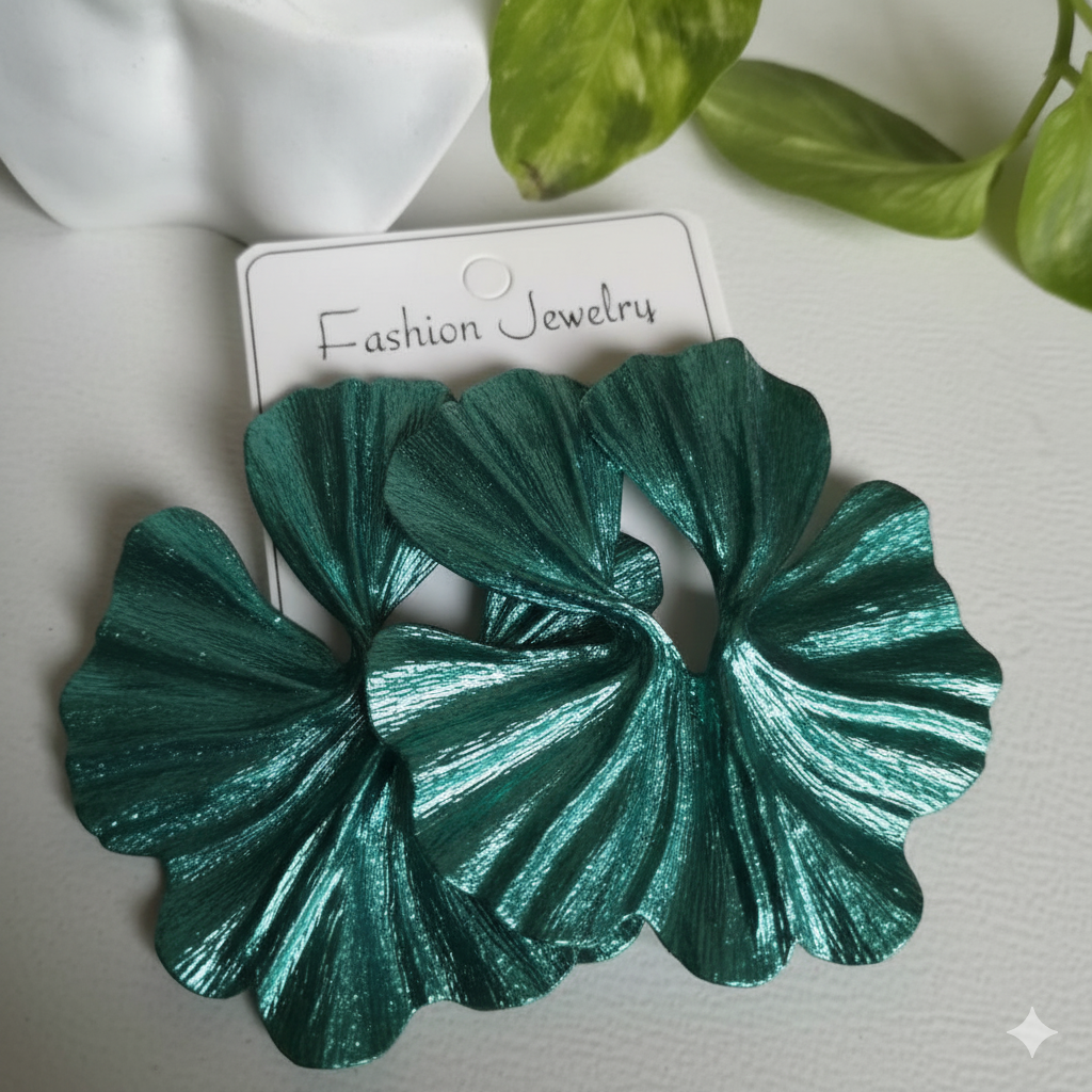 Green leaf-shaped earrings on a white card with 'Fashion Jewelry' text, against a light background.