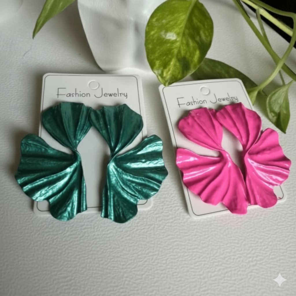 Two scrunchies, one green and one pink, on their respective cards with a light gray background.