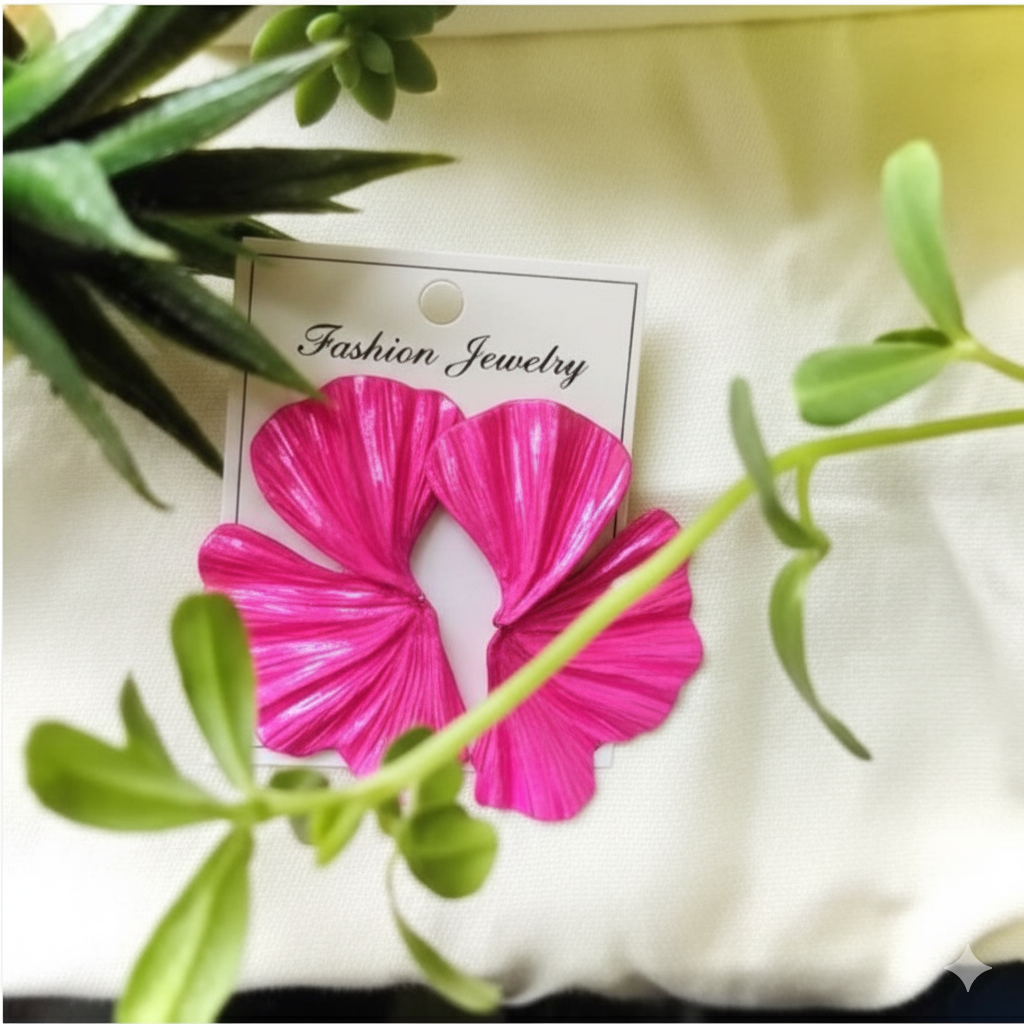 Pink flower-shaped hair scrunchie on a 'Fashion Jewelry' card with green leaves in the background