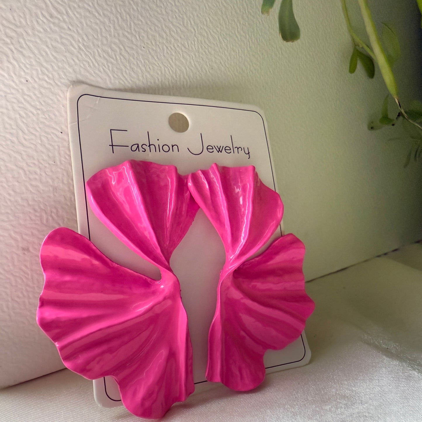 Pink butterfly-shaped earrings on a 'Fashion Jewelry' card with a light background.