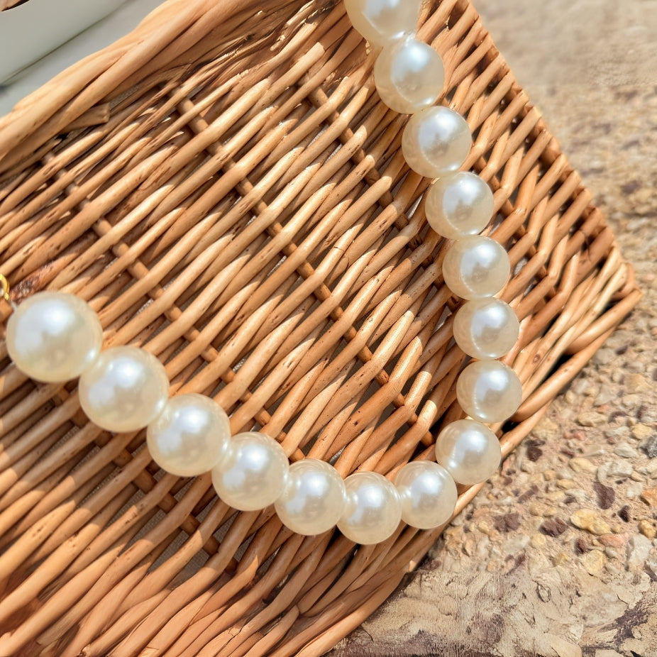 Premium quality straw beach bag featuring oversized pearls for vacation and parties