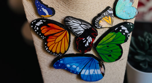 Colorful butterfly-shaped patches on a wooden block