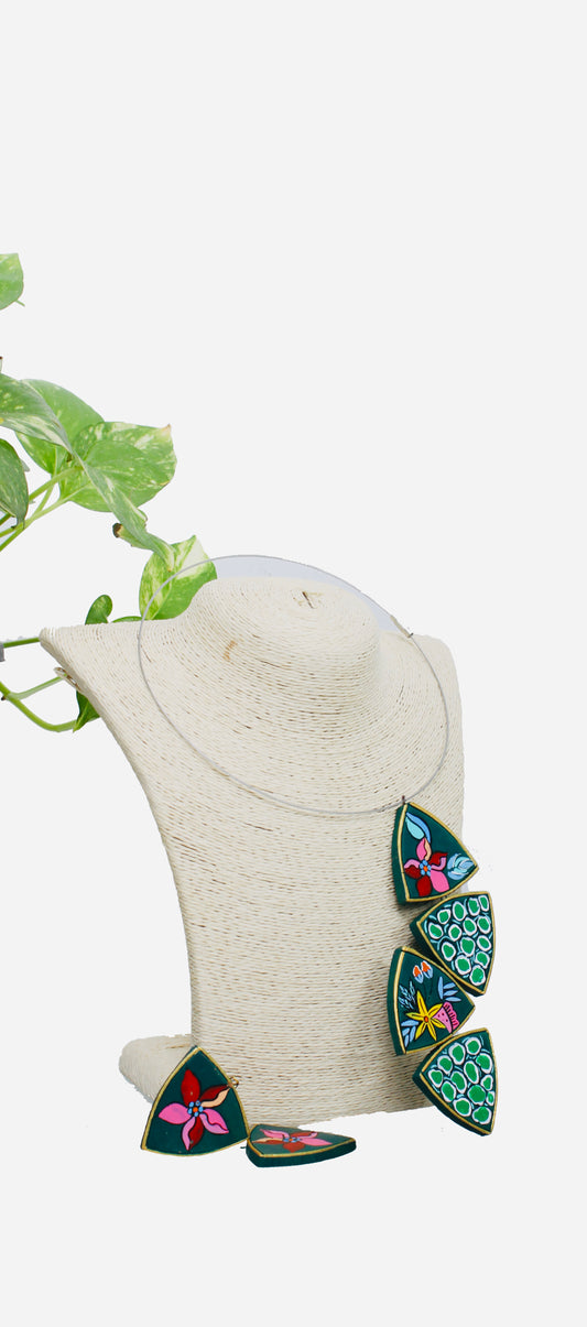 Colorful triangular earrings on a white bust with a white background