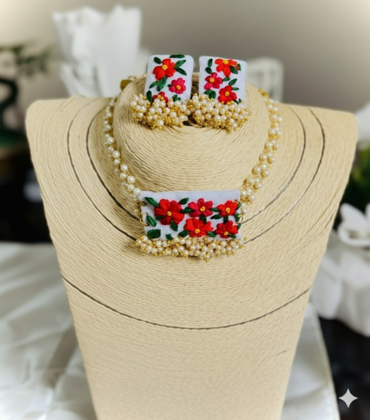 Jewelry set with floral designs on a mannequin bust