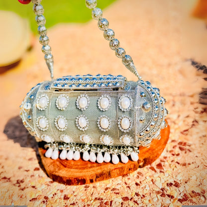 Unique handcrafted round Banjara metal handbag adding charm to traditional outfits