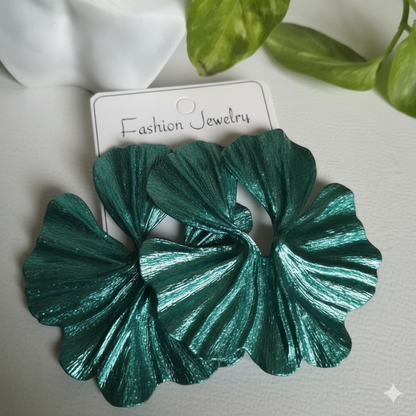 Green leaf-shaped earrings on a white card with 'Fashion Jewelry' text, against a light background.